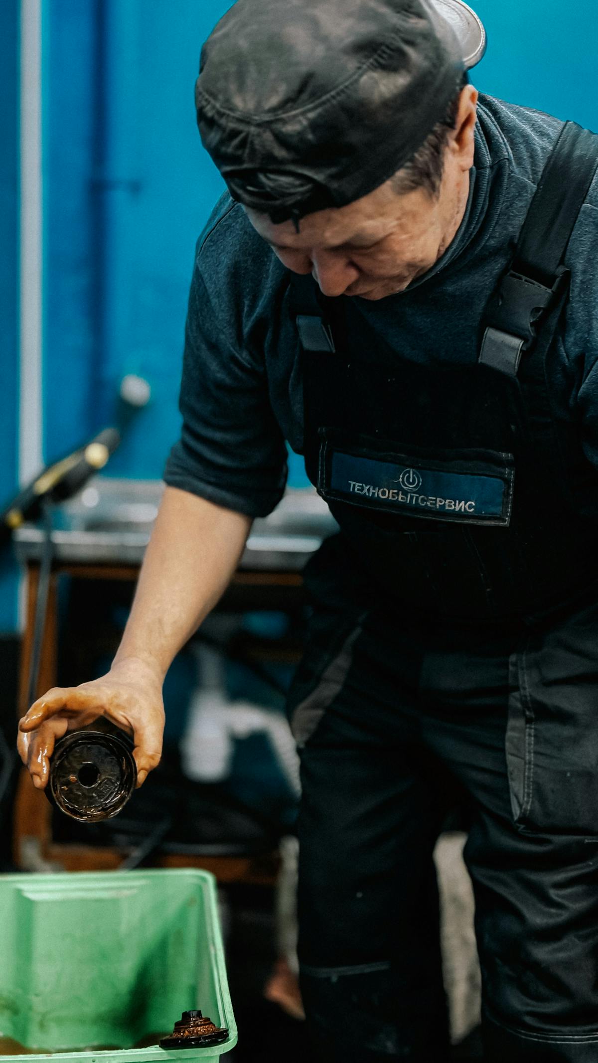 Automobile service technician working inside a workshop